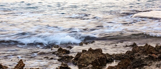 Blurred abstract natural background of sea water with waves and foam. Motion blur. Nature. Banner.	