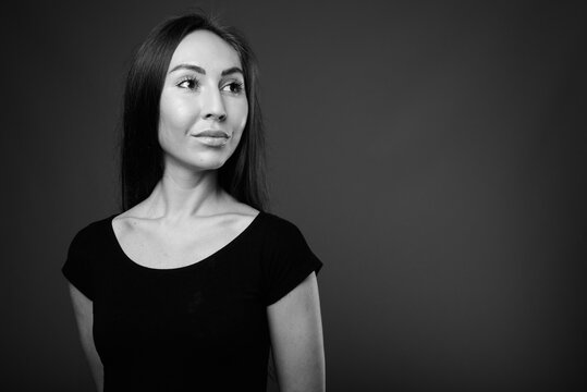 Studio shot of young beautiful woman in black and white