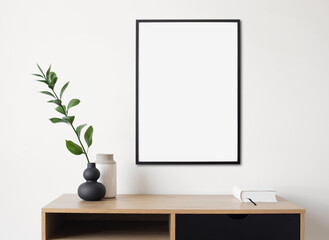 Blank picture frame mockup on white wall. Artwork in design interior. Modern scandinavian style. Home staging and minimalism concept