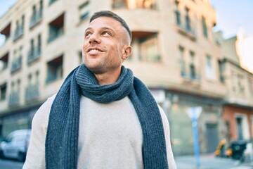 Young caucasian man smiling happy walking at the city.