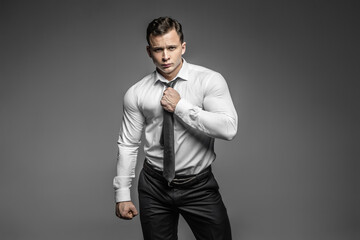 Strong and elegant young man possing in studio