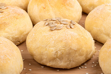 Close-up of homemade lean bun with sesame and sunflower seeds.