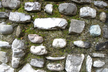 A stony wall with moss