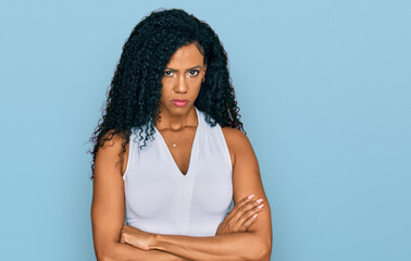 Middle age african american woman wearing casual style with sleeveless shirt skeptic and nervous,...