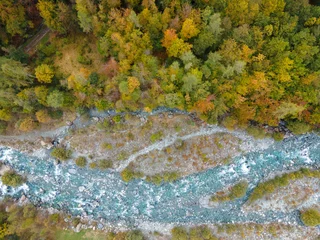  aerial mountain view of forest with autumnal colors. river with flowing water © Andrea