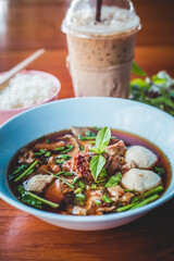 stewed Beef noodle soup, Noodle soup thai style put blood in the soup hot for mellow soup (Pork or Beef) on wooden table
