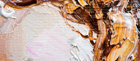 .Embossed pasty oil paints and reliefs. Primary colors: brown, white, yellow, orange. Abstract art. Mix of paints.