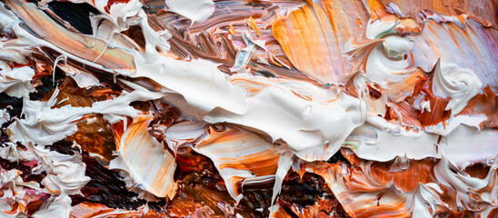 .Embossed pasty oil paints and reliefs. Primary colors: brown, white, pink, orange. Abstract art. Mix of paints.