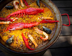 Traditional seafood paella in the fry pan