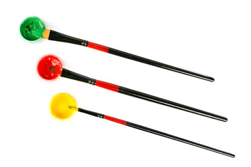 Gouache and brushes isolated on white.