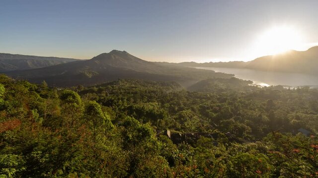 Landscape of Mount Batur Volcano and Lake in Kintamani, Bali, Indonesia - Morning Sunrise Time Lapse