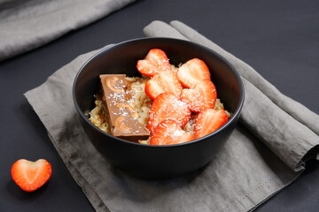 Oatmeal with strawberries. Cooking. Food.