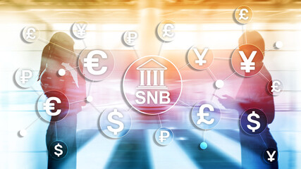 Different currencies on a virtual screen. SNB. Swiss National Bank