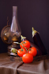 Rustic arrangement with  tomatoes and eggplants 