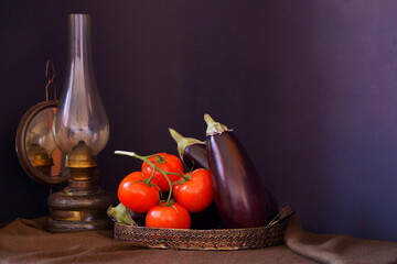 Rustic arrangement with  tomatoes and eggplants 
