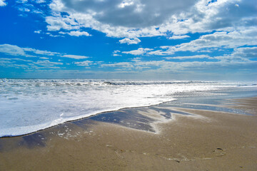 Beach waves and clouds