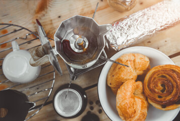 Coffee making with Moka pot and snack.