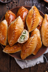 mini pie with green onion and egg. rustic style