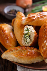 mini pie with green onion and egg. rustic style