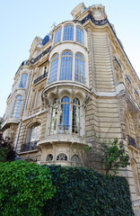 Traditional French house with typical balconies and windows. Paris.