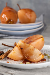 Poached pears delicious home made recipe over light kitchen countertop