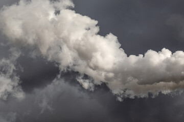 Obraz premium The chimney in deep blue heavy sky of a thermal power plant, the smoke extracted in the production process from pipe. Environment. Pollution..