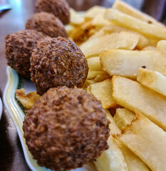 Chickpea Hummus and Falafel on a plate. Healthy arabic vegetarian appetizer food. Closeup view