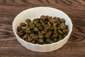 Tasty capers in the bowl