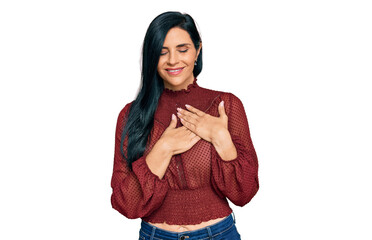 Young caucasian woman wearing casual clothes smiling with hands on chest with closed eyes and grateful gesture on face. health concept.