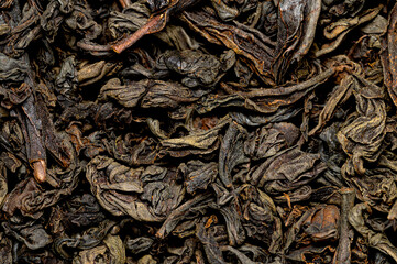 Black tea background. Large-leaf, black tea close-up