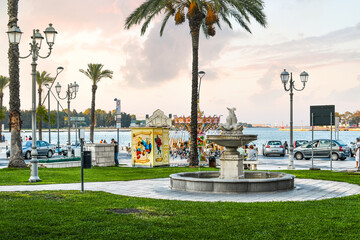 Obraz premium Morning at a small amusement park at the Piazza Vittorio Emanuele II along the coast of the Adriatic Sea in Brindisi, Italy