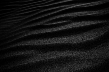 Black Sand dune. Black Sand beach macro photography. Background, texture, wave pattern of oceanic...