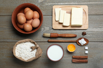 Cooking utensils and ingredients on wooden table, flat lay