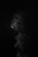 White steam column rising on black background