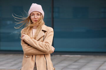 girl in a hat on a windy walk