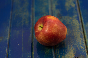 Fresh apple of the gala variety on wooden background