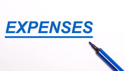 On a light background, an open blue felt-tip pen and the text EXPENSES