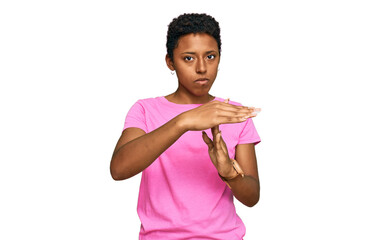 Young african american woman wearing casual clothes doing time out gesture with hands, frustrated and serious face