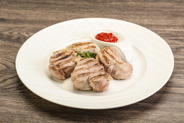 Grilled pork tenderlion with tomato sauce