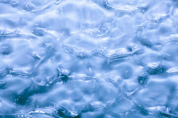 Cream gel gray blue transparent cosmetic sample texture with bubbles background