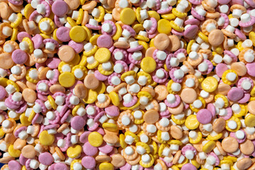 Many colourful mushroom-shaped candies 