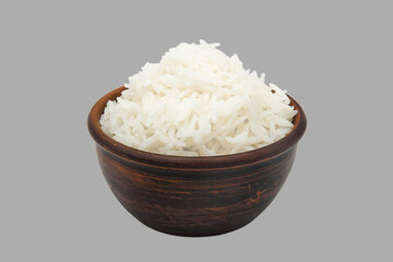 boiled white rice in clay bowl isolated on gray background