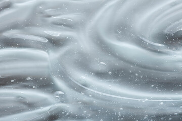 Cream gel face foam shower shampoo transparent cosmetic sample texture with bubbles background