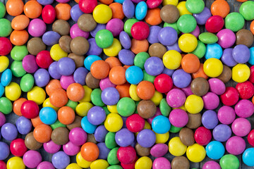 A background of colourful round candies 