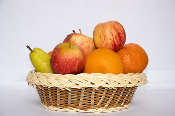 Beautiful Fruits In The Basket In White Isolated Background