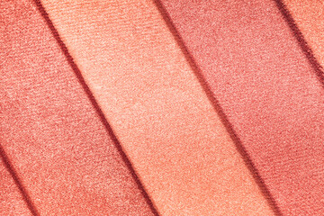 Fototapeta premium Blusher or bronzer shimmering palette texture pressed background