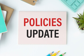 Policies update text concept write on notebook
