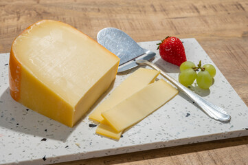 Cheese collection, piece of young Dutch gouda cheese made from cow milk in Netherlands