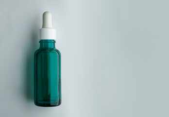 Liquid green gel or serum glass background