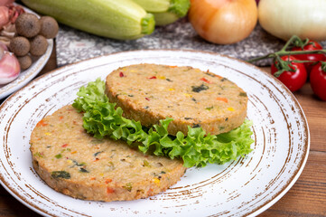 Round vegetarian patties or burgers made from grains, vegetables and legumes